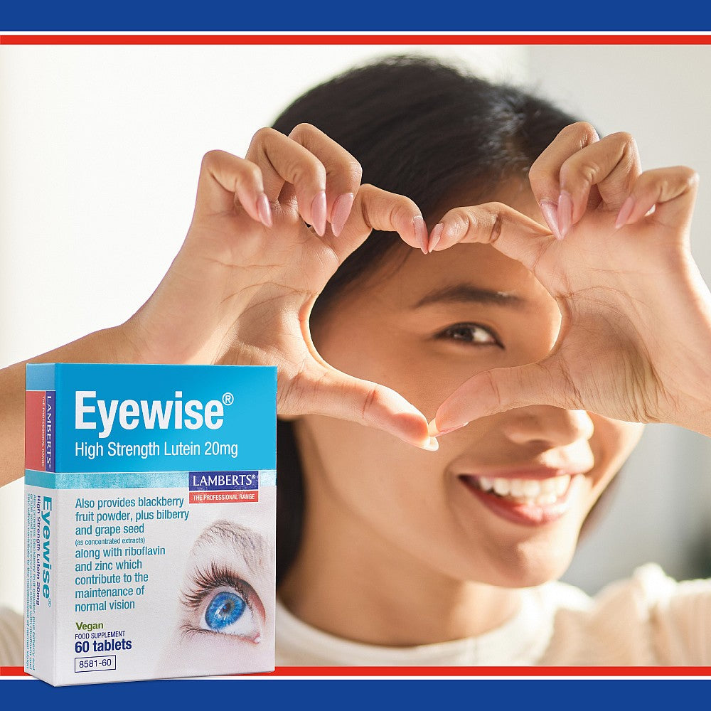Woman making a heart shape with her hands and an Eyewise supplement box in the foreground.