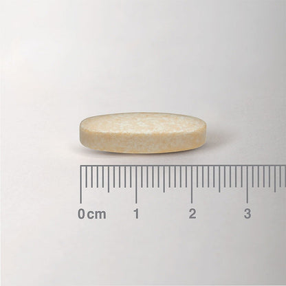Beige tablet with a ruler for scale on a white background