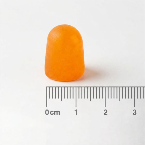 An orange translucent foam earplug shown above a 0-3 cm ruler for scale on a plain white background.