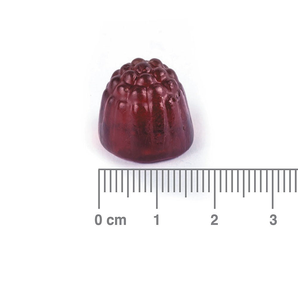 Red jelly candy with a textured surface on a white background, accompanied by a ruler for scale.