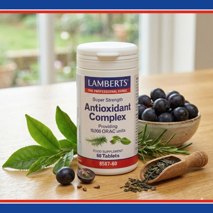 Lambert's Super Strength Antioxidant Complex supplement bottle on a wooden table with blueberries and green leaves.
