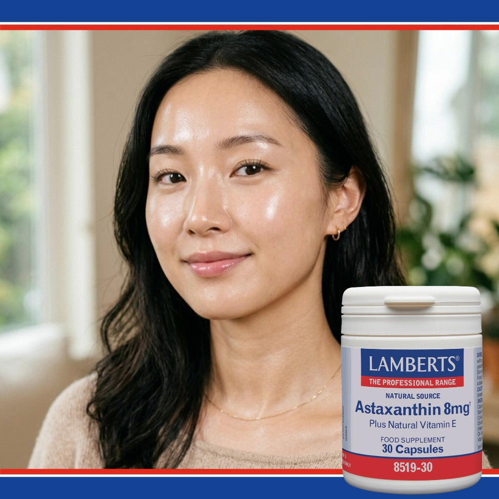 Woman with a supplement container labeled 'Lamberts' on a blurred background