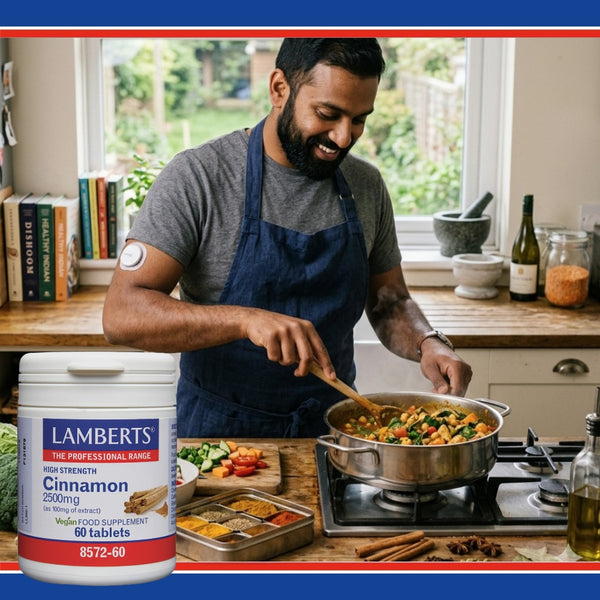 Man cooking in a kitchen with a Lamberts cinnamon supplement container in the foreground.