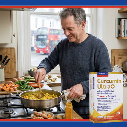 Man cooking in a kitchen with a box of Lamberts Curcumin Ultra in the foreground