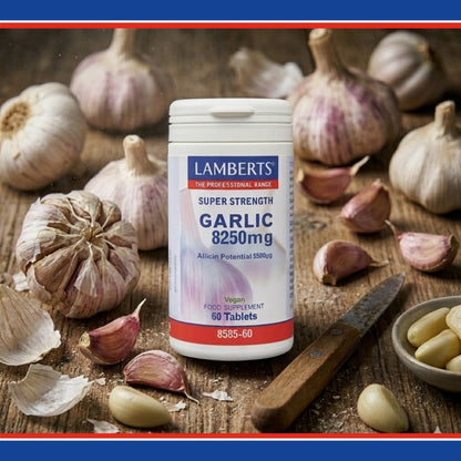 Lamberts Super Strength Garlic 8250mg supplement bottle on a wooden surface with garlic bulbs.
