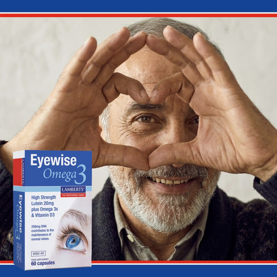 Man making a heart shape with his hands, with an Eyewise Omega 3 supplement box in the foreground.