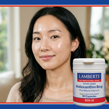 Woman with a supplement bottle labeled 'Lambert's Astaxanthin' in a blurred indoor setting