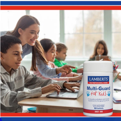 Children in a classroom with a bottle of Lamberts Multi-Guard for Kids supplement in the foreground.