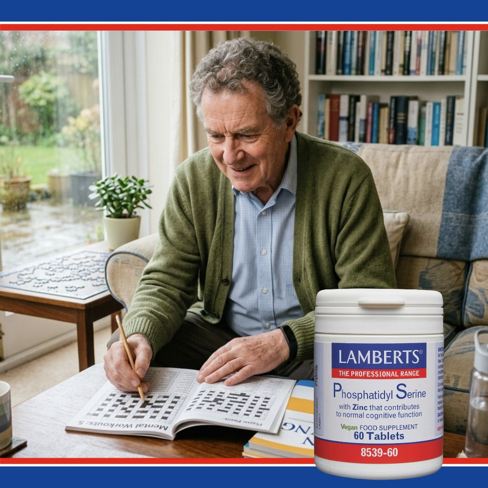 Man solving a crossword puzzle with a Lamberts supplement container in the foreground.