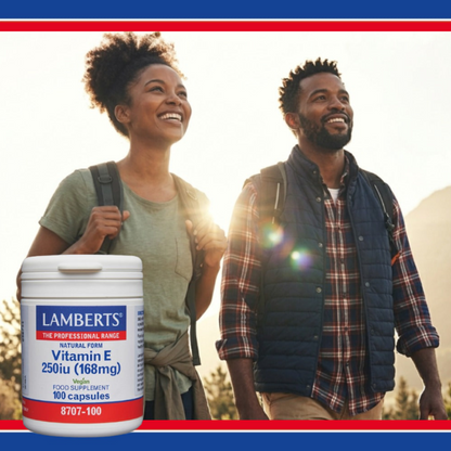 Two people hiking with a Lamberts vitamin E supplement container in the foreground.