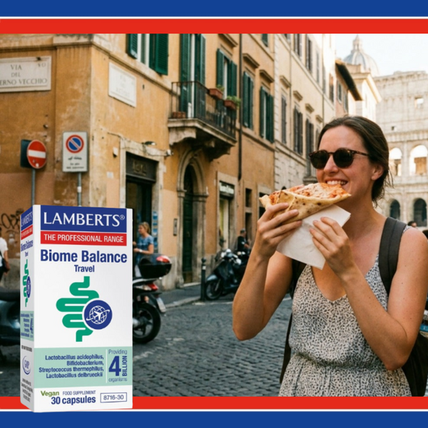 Woman eating pizza on a street with a Lamberts Biome Balance Travel supplement box in the foreground.