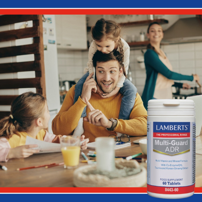 Family in a kitchen with a bottle of Lamberts Multi-Guard ADR supplement in the foreground.
