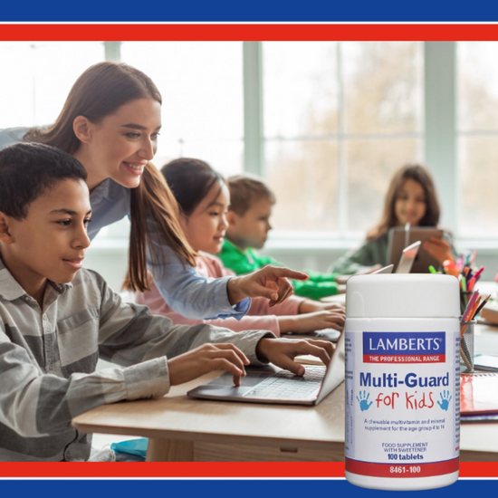 Children in a classroom with a bottle of Lamberts Multi-Guard for Kids supplement.