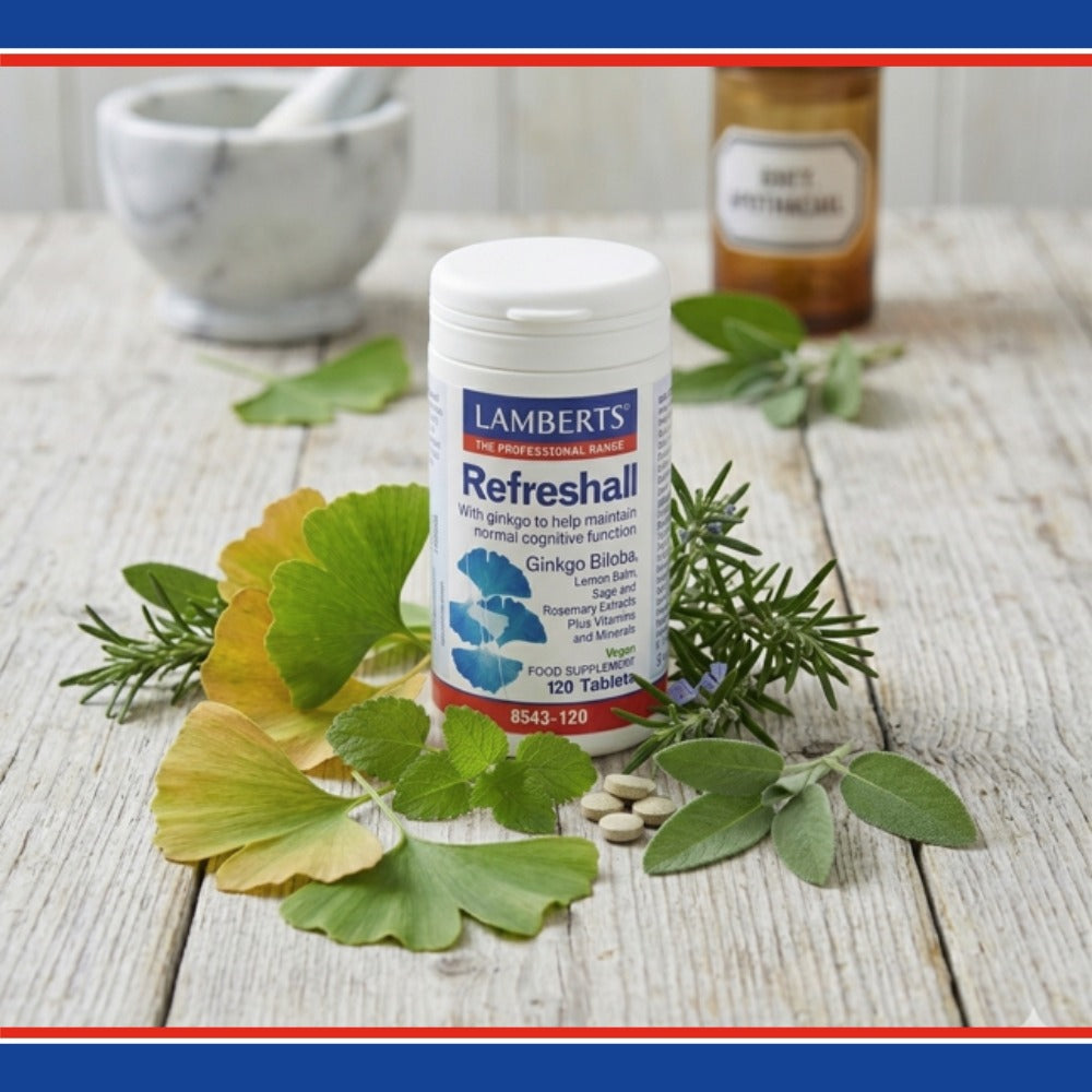 Lambert's Refreshall supplement bottle on a wooden surface with green leaves and herbs.