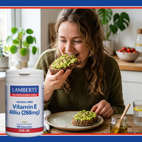 Woman eating avocado toast with a container of Lamberts Vitamin E supplement in the foreground.